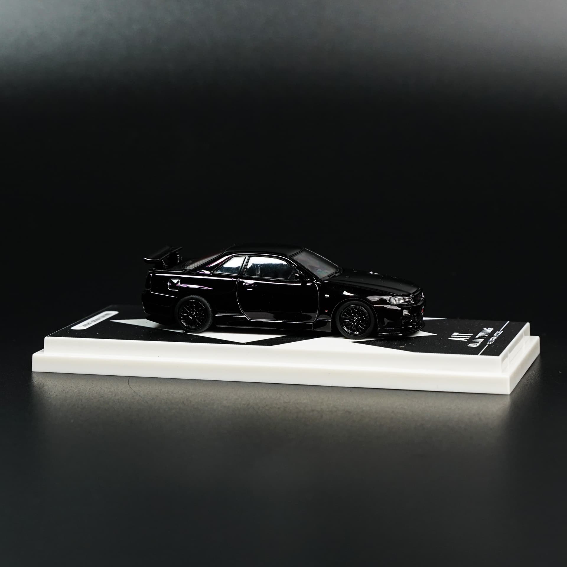 Nissan GTR 34 Black Aurora Model - model 1:64 - miniatura 2