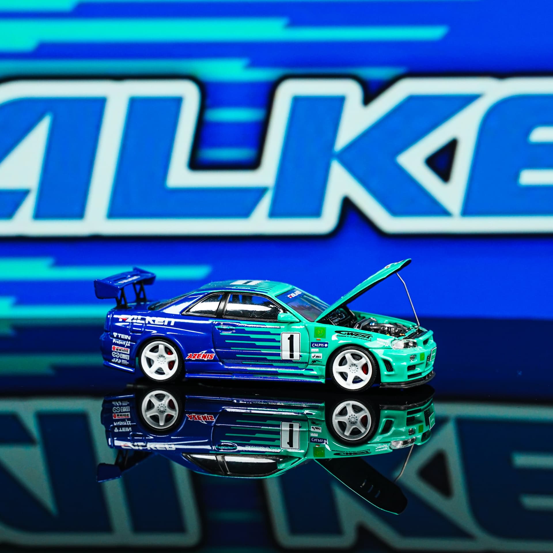 Nissan GTR 34 Falken TimeMicro - model 1:64 - miniatura 1